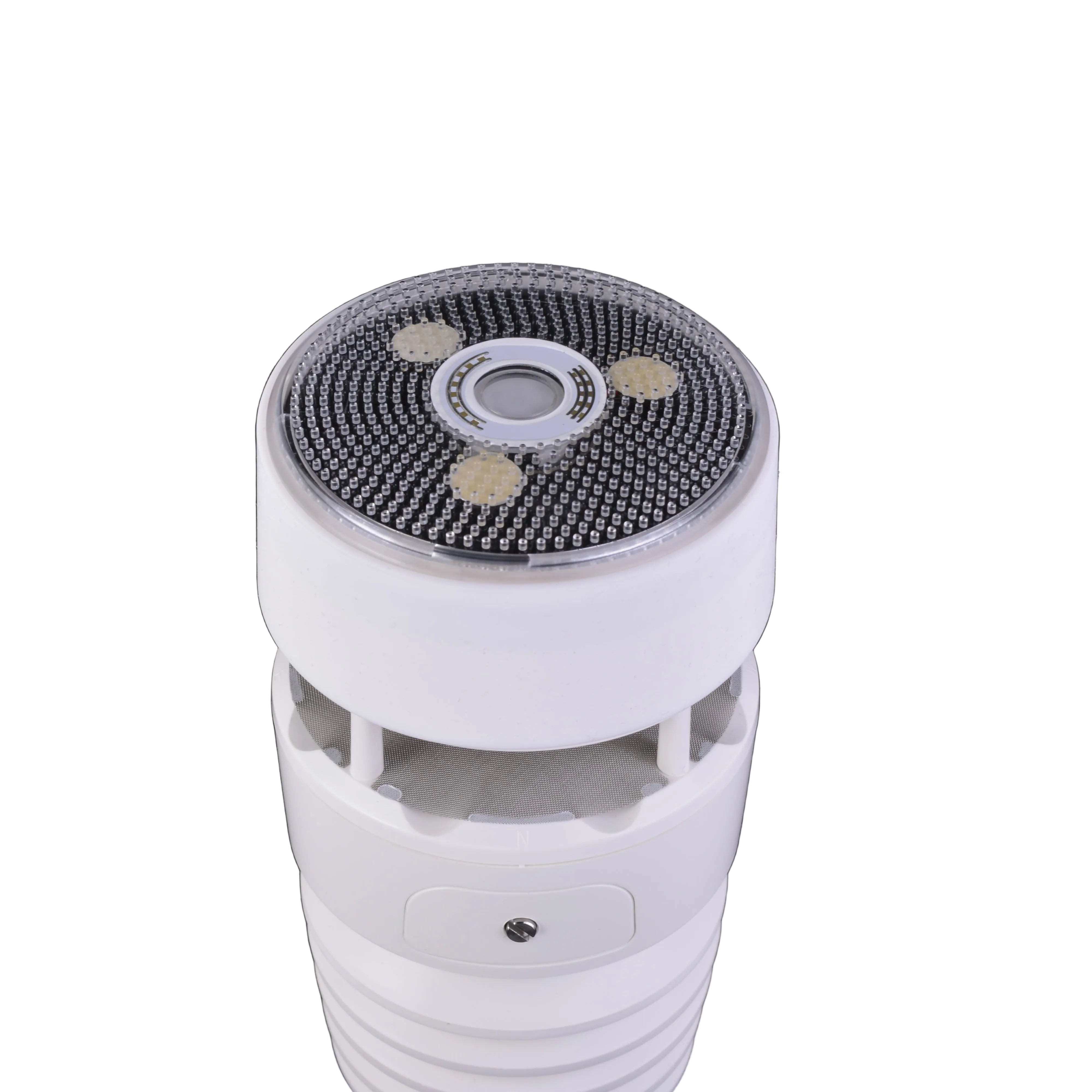 White electric shaver head on a black background