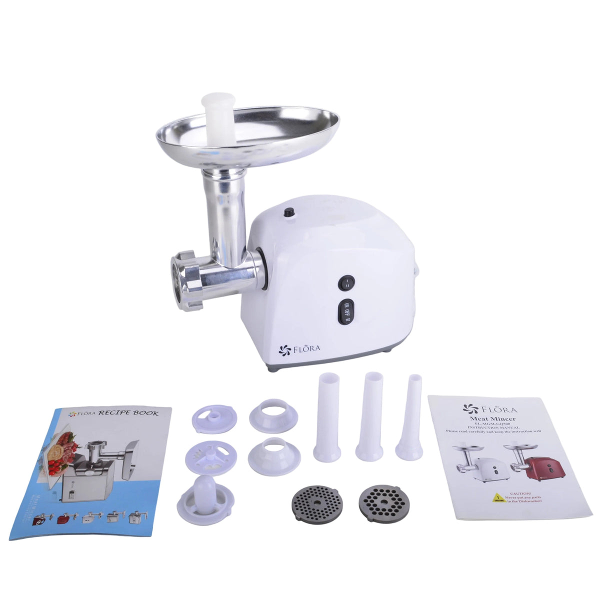 A white electric meat grinder with a stainless steel hopper, shown with its accessories and user manuals on a light gray surface against a white background.
