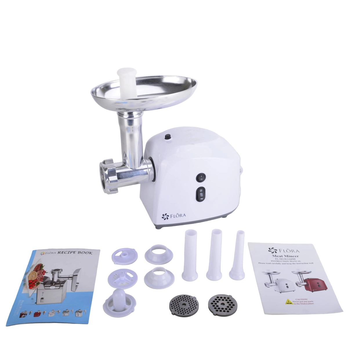 A white electric meat grinder with a stainless steel hopper, shown with its accessories and user manuals on a light gray surface against a white background.