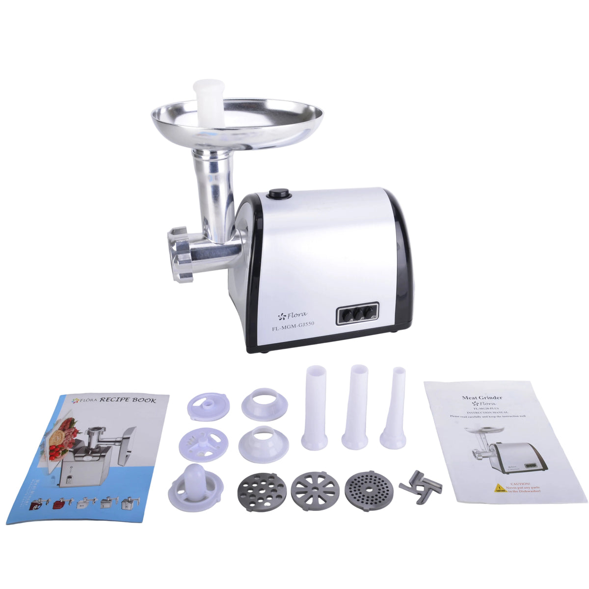 A countertop meat grinder with a white and black body and silver metal hopper, shown on a light gray surface with accessories and two instruction manuals laid out in front.