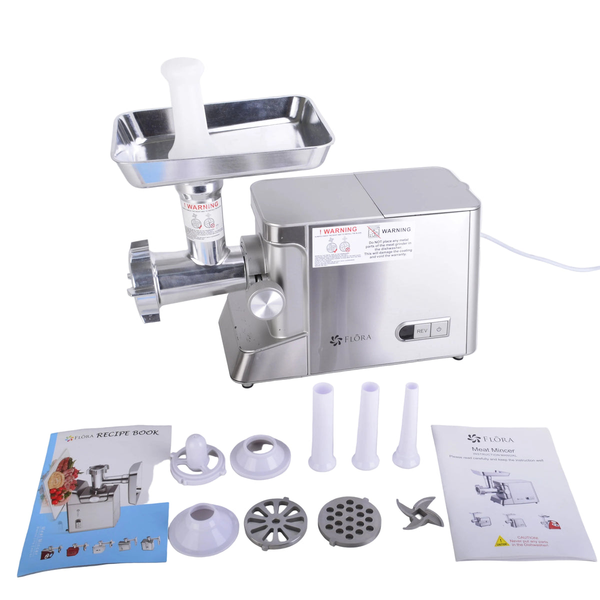 A stainless steel electric meat grinder with its accessories and manuals laid out on a white surface against a white background.