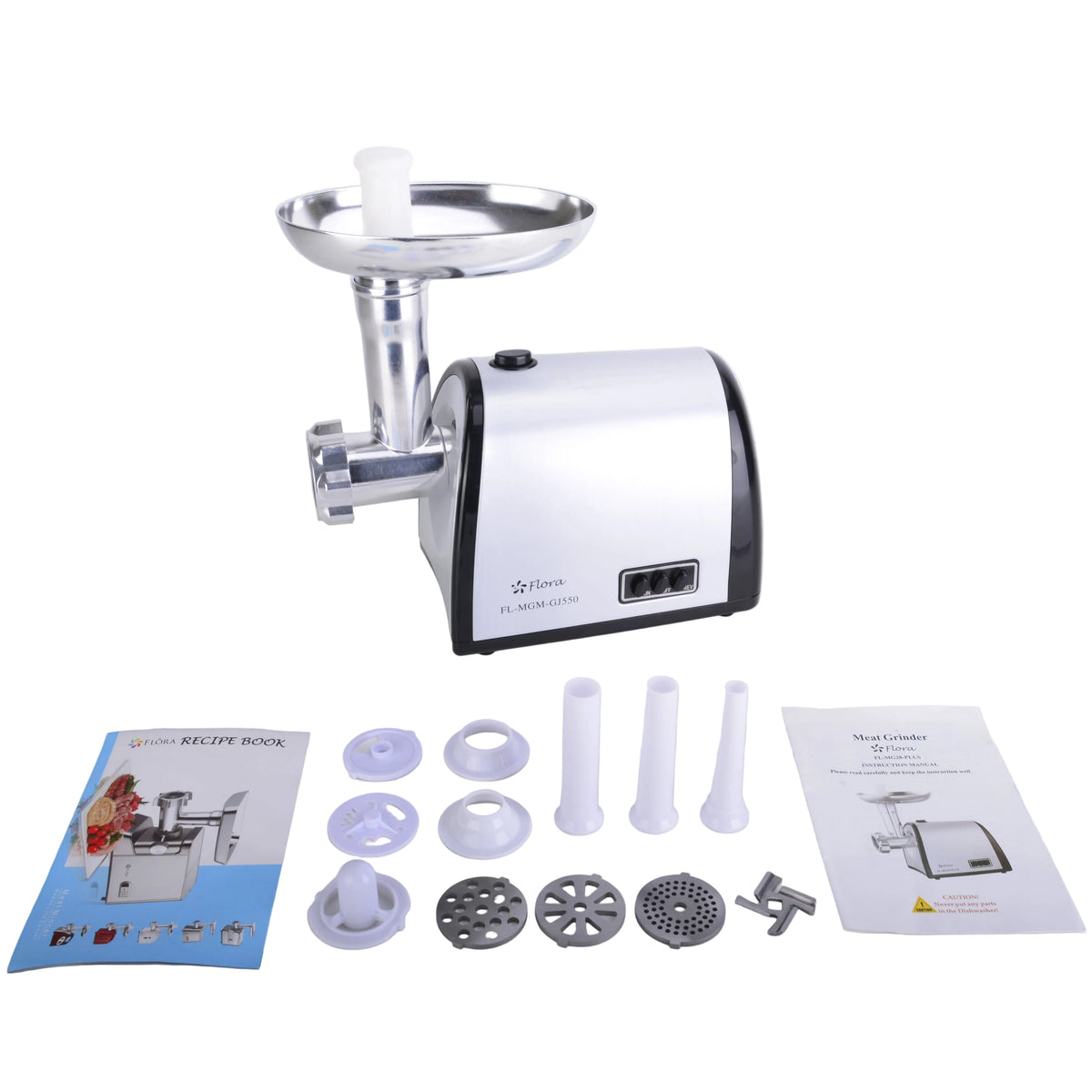 A countertop meat grinder with a white and black body and silver metal hopper, shown on a light gray surface with accessories and two instruction manuals laid out in front.