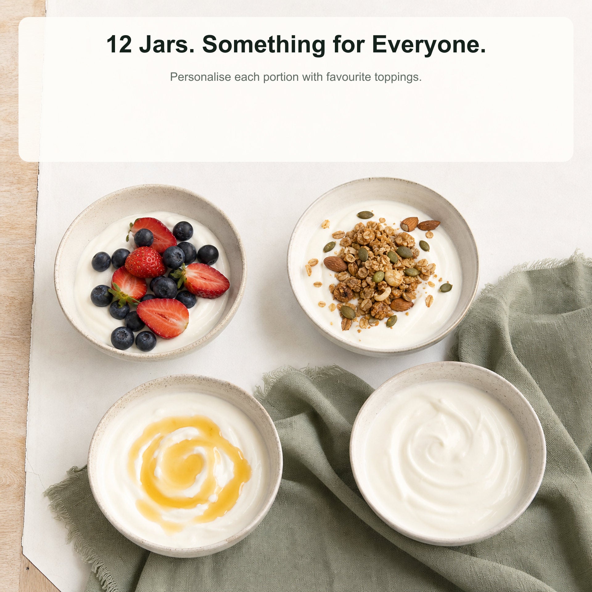 Four bowls of yogurt with different toppings on a white surface.