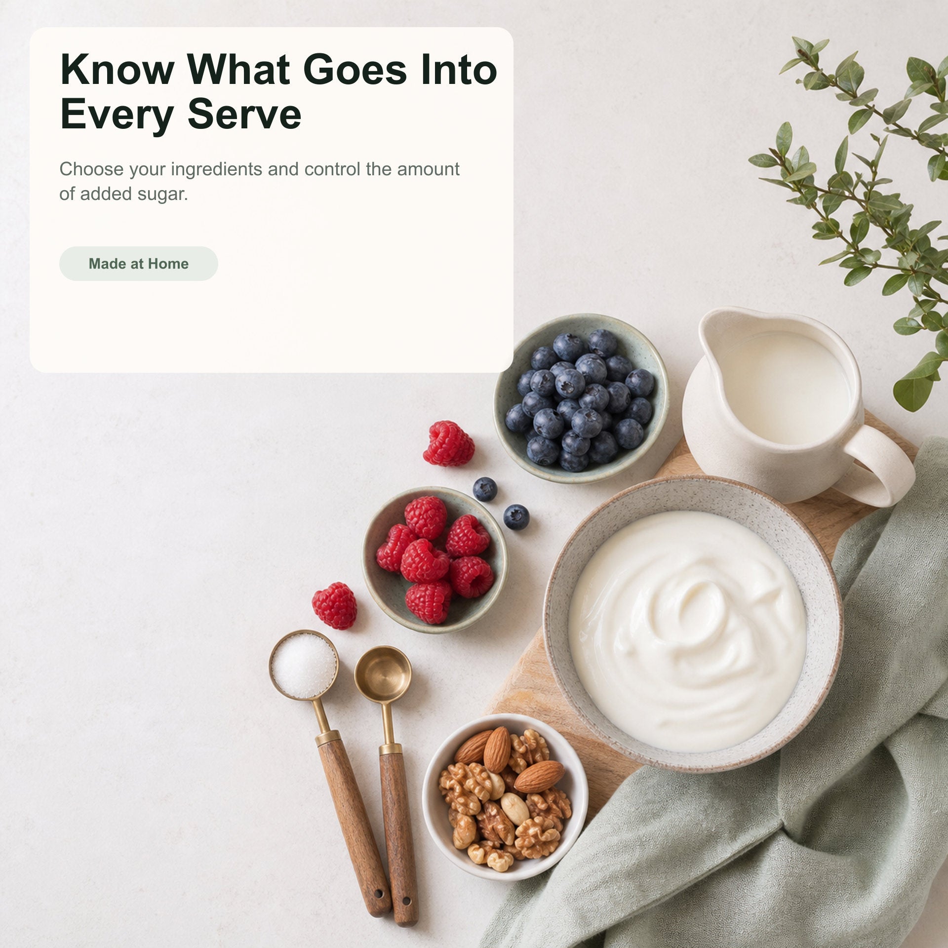 Yogurt with berries, nuts, and spoons on a white surface with text overlay.